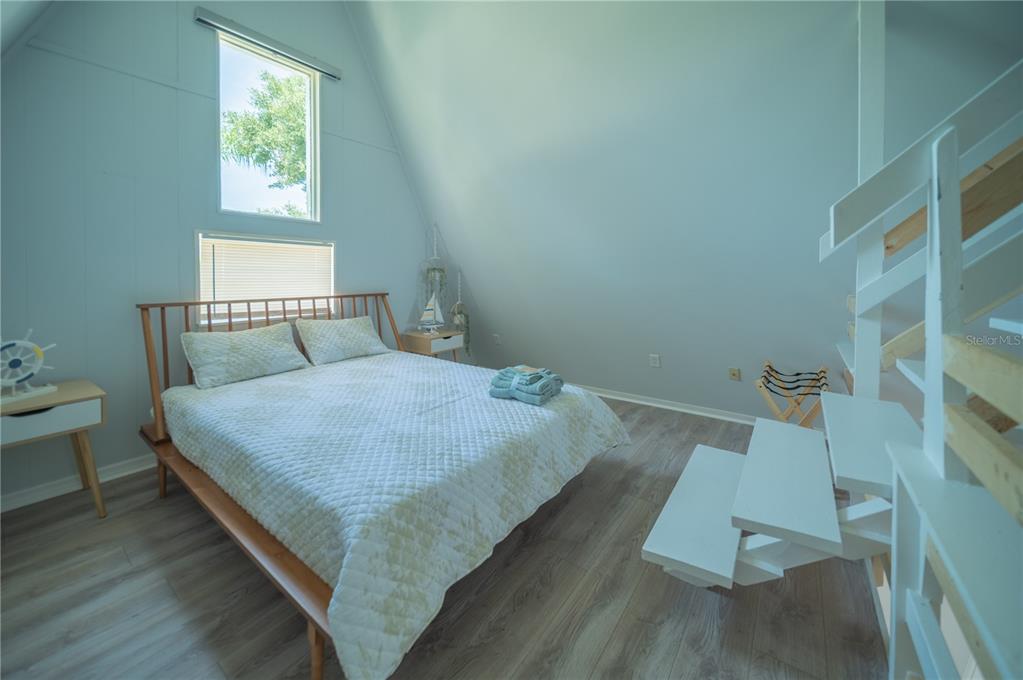 501 Pameto Road Nokomis, FL 34275 - Photo 21 of 37 a bedroom with a bed and window