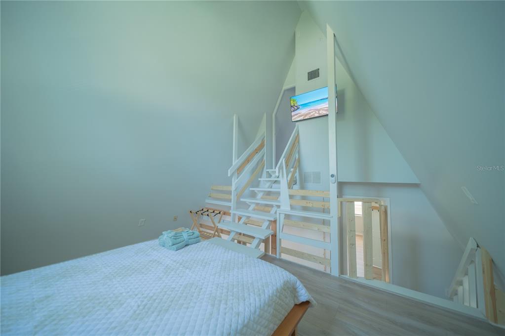 501 Pameto Road Nokomis, FL 34275 - Photo 22 of 37 a bedroom with bed and a window