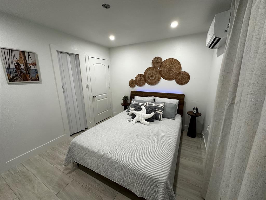 501 Pameto Road Nokomis, FL 34275 - Photo 27 of 37 a bedroom with a bed and a window
