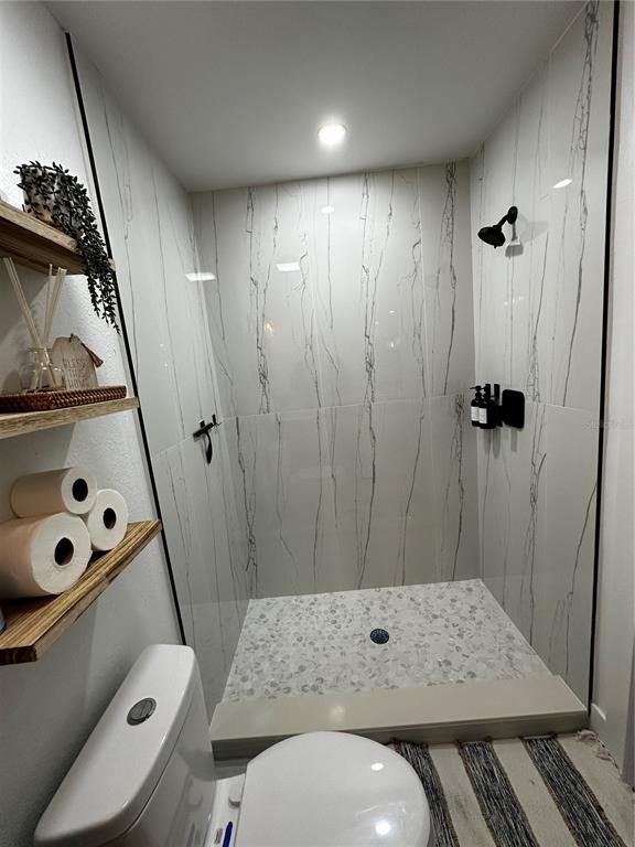 501 Pameto Road Nokomis, FL 34275 - Photo 28 of 37 a bathroom with a sink a toilet and shower