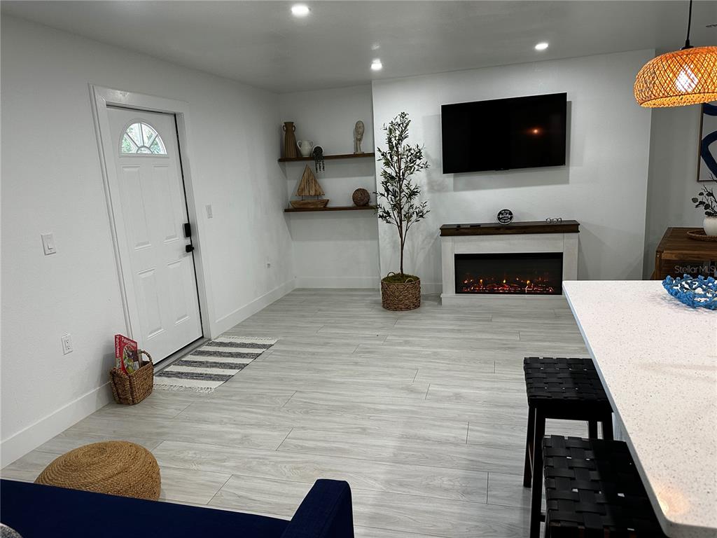 501 Pameto Road Nokomis, FL 34275 - Photo 29 of 37 a living room with furniture and a flat screen tv