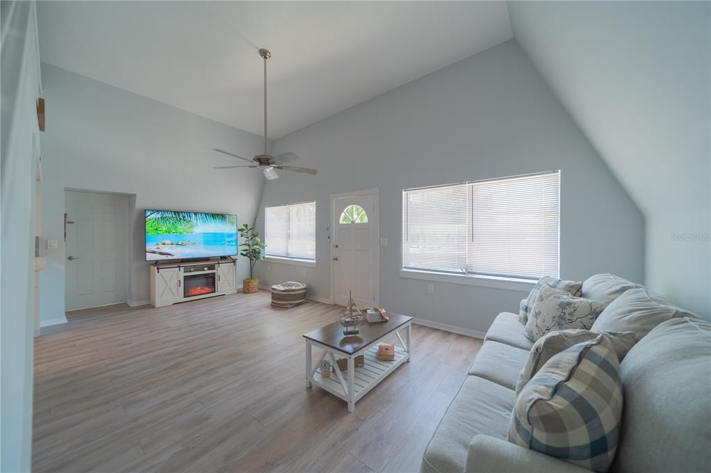 501 Pameto Road Nokomis, FL 34275 - Photo 4 of 37 a living room with furniture and a wooden floor