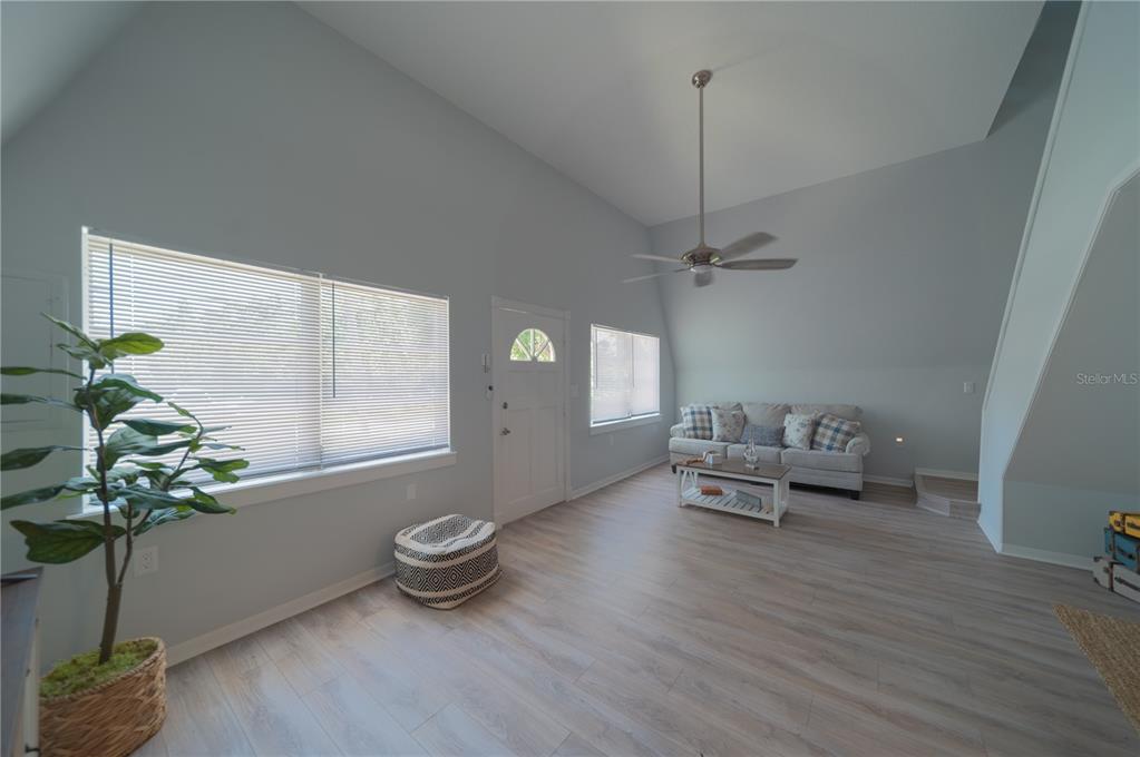 501 Pameto Road Nokomis, FL 34275 - Photo 6 of 37 a living room with furniture and a potted plant