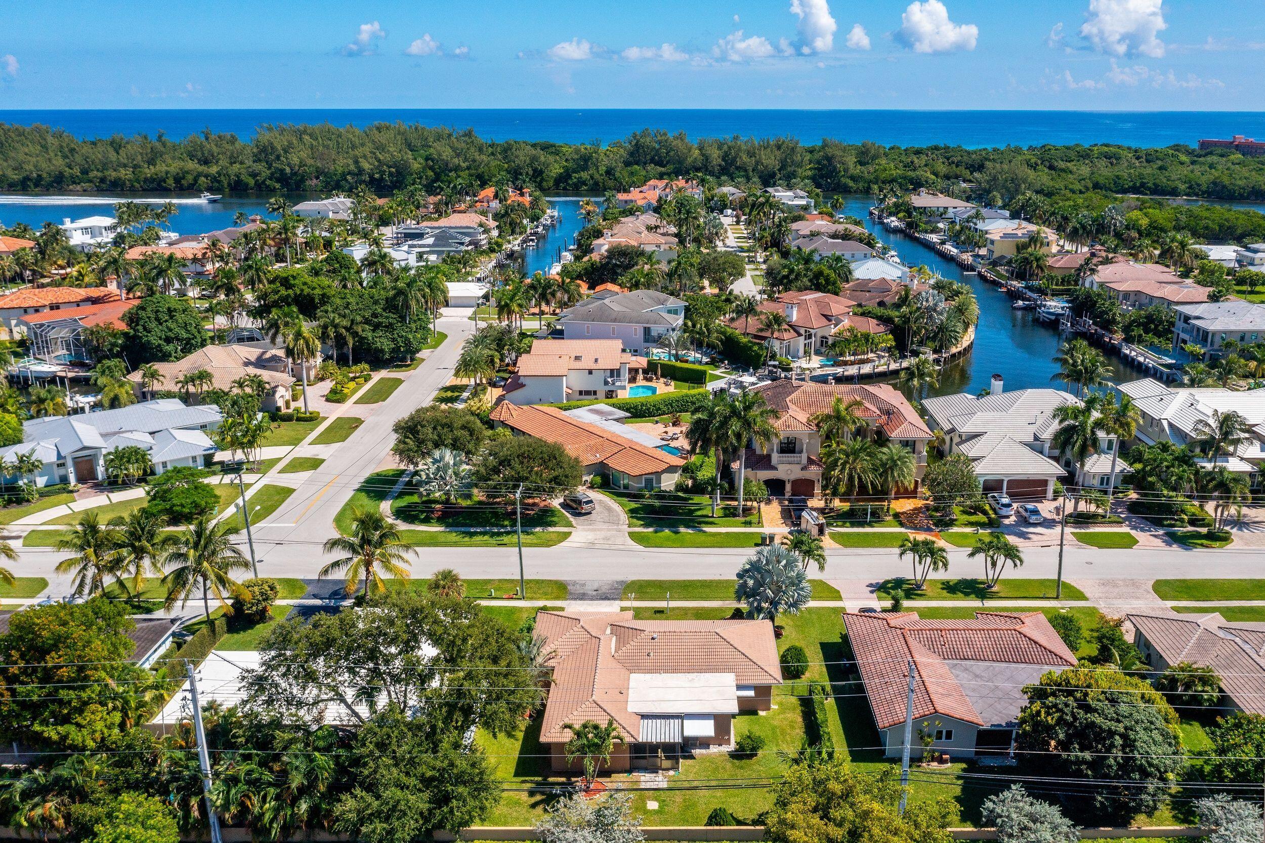 3363 Northeast 6th Drive Boca Raton, FL 33431 - Photo 1 of 1 an aerial view of residential houses with outdoor space and swimming pool