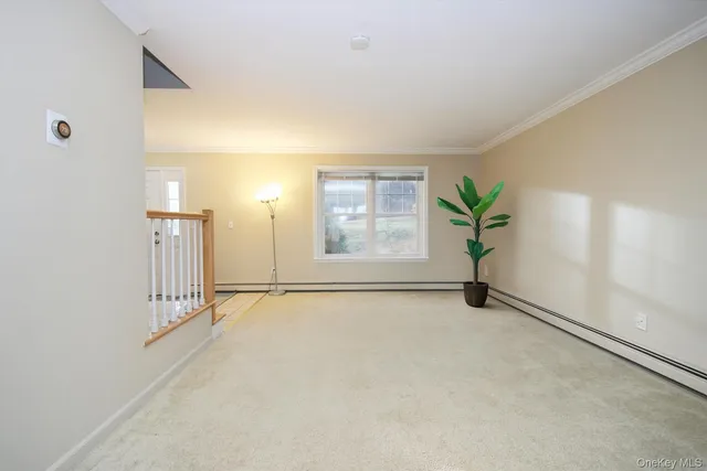 an empty room with windows and entrance