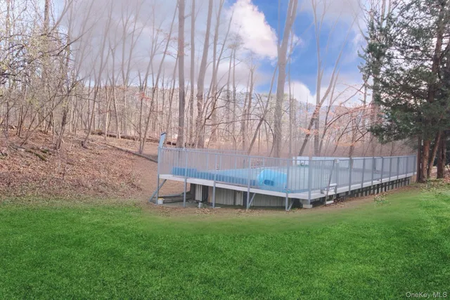 a view of a backyard with a wooden fence