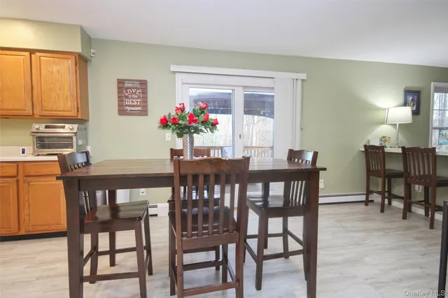a dining room with furniture and window