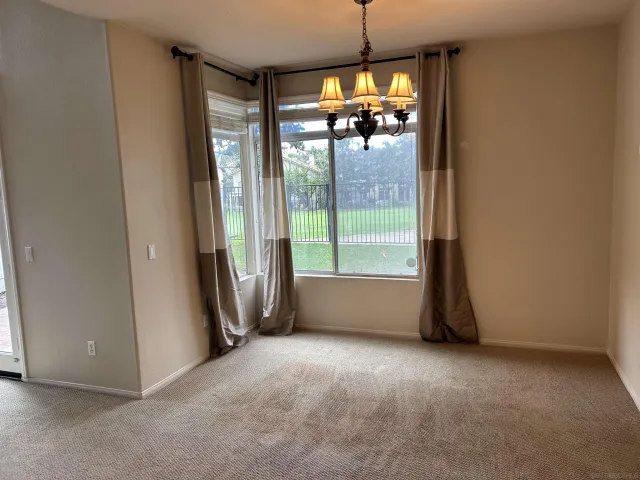 a view of livingroom with furniture and floor to ceiling window