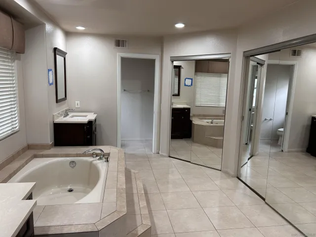 a bathroom with a sink and mirror