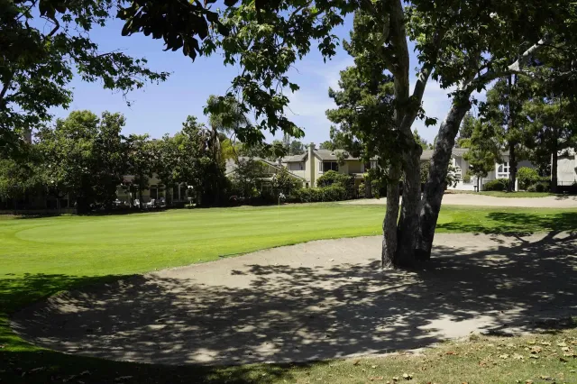 a view of a lake with green space