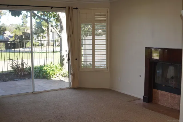 a view of an empty room with windows