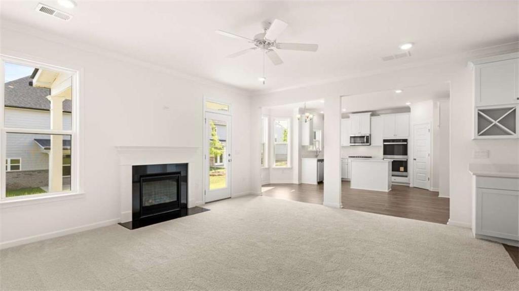 13623 Whitman Lane Covington, GA 30014 - Photo 15 of 45 a view of a livingroom with a fireplace and cabinet
