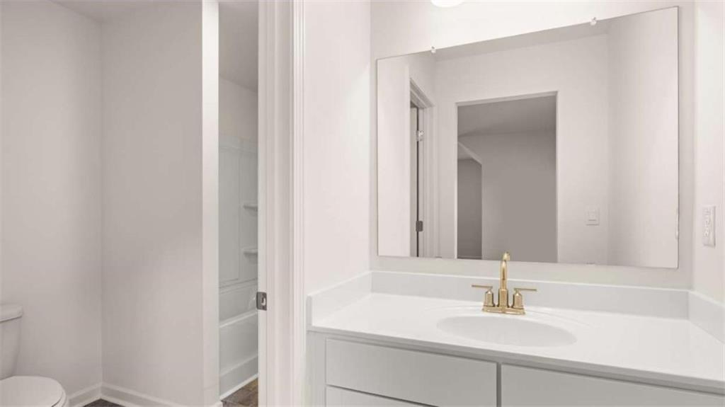 13623 Whitman Lane Covington, GA 30014 - Photo 38 of 45 a bathroom with a sink and a mirror