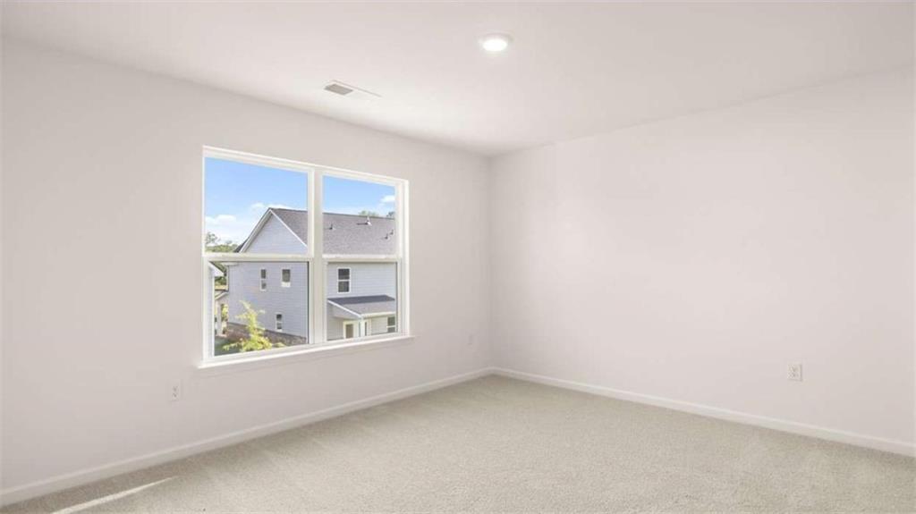 13623 Whitman Lane Covington, GA 30014 - Photo 39 of 45 an empty room with windows