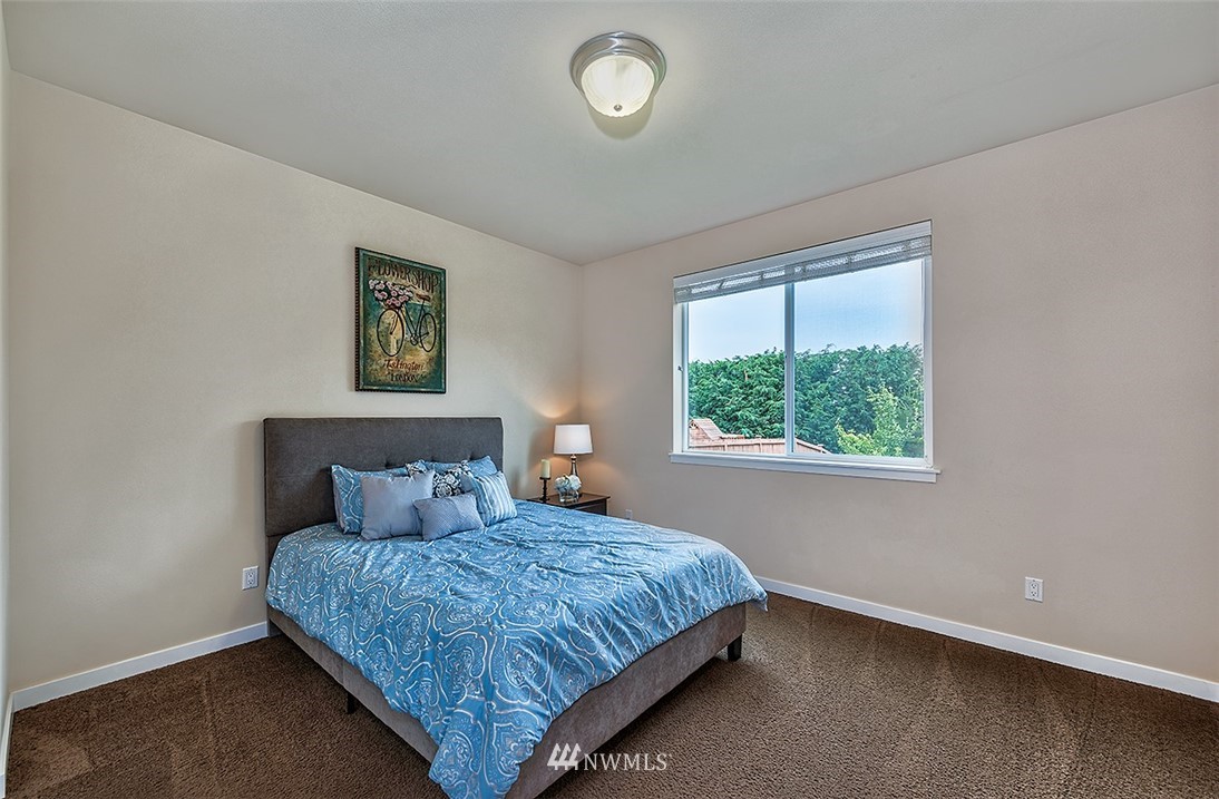 4201 222nd Place Southeast Bothell, WA 98021 - Photo 12 of 25 a bedroom with a bed and a window
