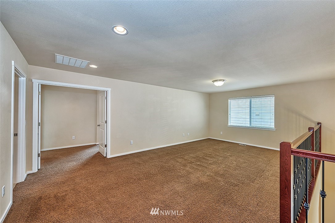 4201 222nd Place Southeast Bothell, WA 98021 - Photo 14 of 25 an empty room with windows and closet