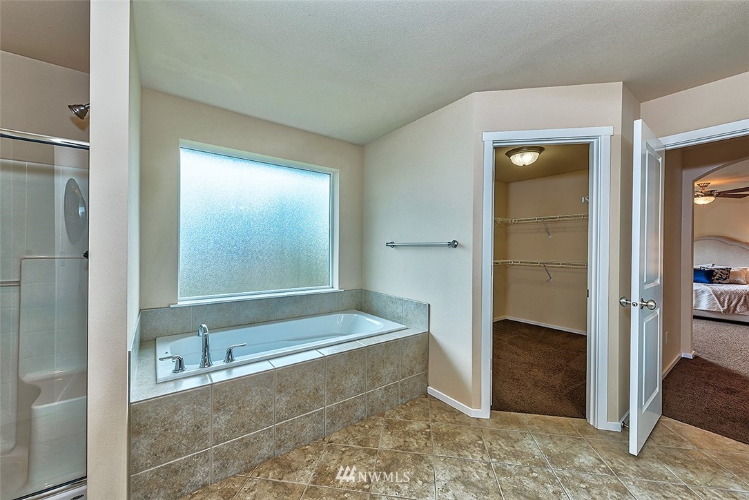 4201 222nd Place Southeast Bothell, WA 98021 - Photo 17 of 25 a bathroom with a tub and a sink