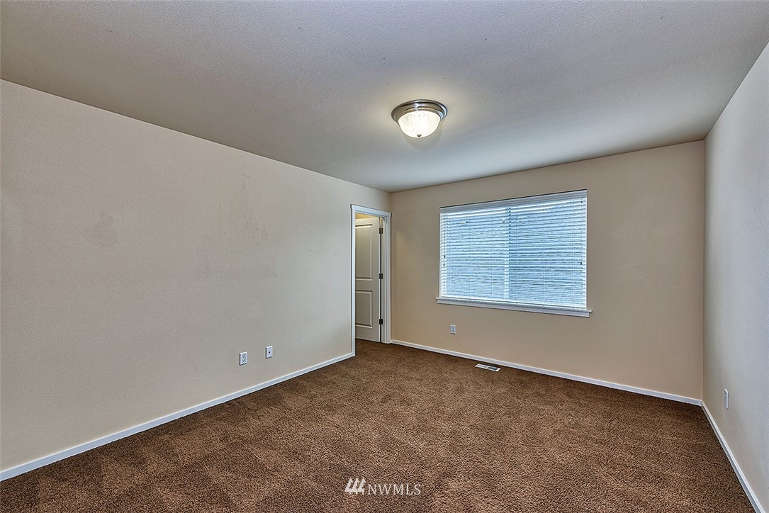 4201 222nd Place Southeast Bothell, WA 98021 - Photo 18 of 25 an empty room with a empty space and windows