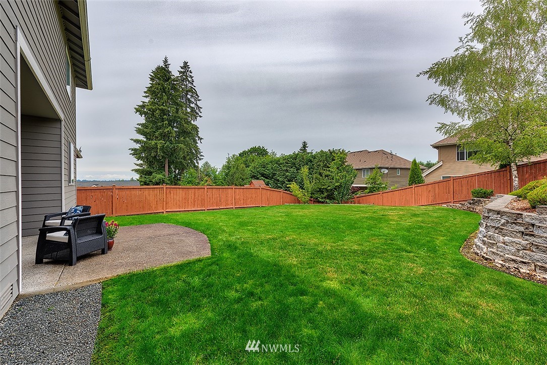 4201 222nd Place Southeast Bothell, WA 98021 - Photo 23 of 25 a view of yard with seating area and green space
