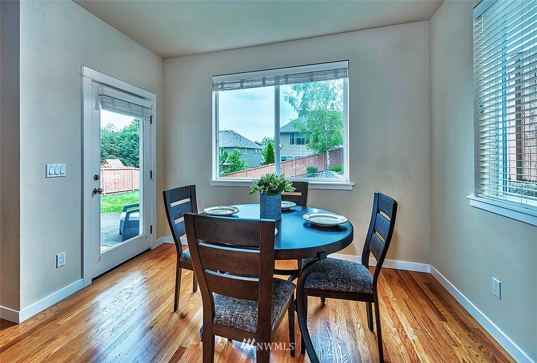 4201 222nd Place Southeast Bothell, WA 98021 - Photo 8 of 25 a dining room with furniture and wooden floor