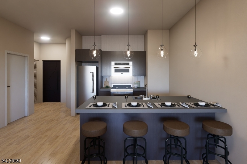74 Webster Street Newark, NJ 07104 - Photo 8 of 22 a kitchen with cabinets table and chairs