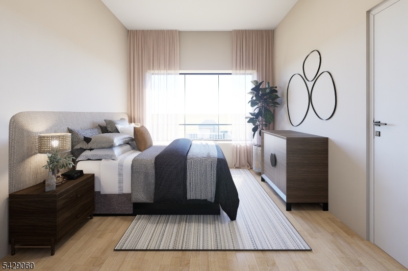 74 Webster Street Newark, NJ 07104 - Photo 10 of 22 a spacious bedroom with a bed and window