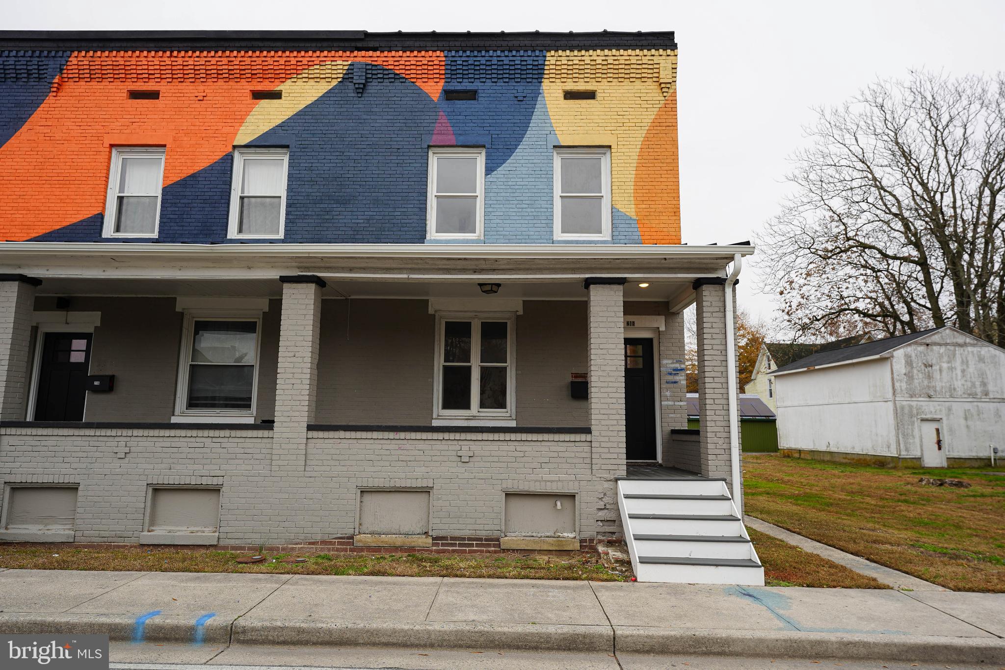 front view of a house with a swimming pool