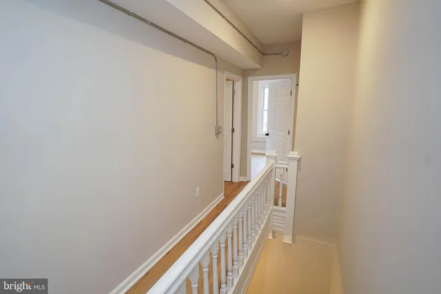 a view of a hallway with stairs