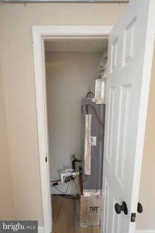 a bathroom with a toilet sink vanity and mirror