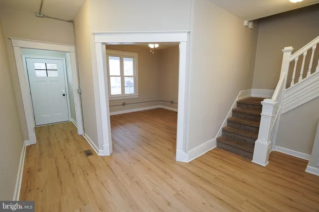 a view of entryway with wooden floor