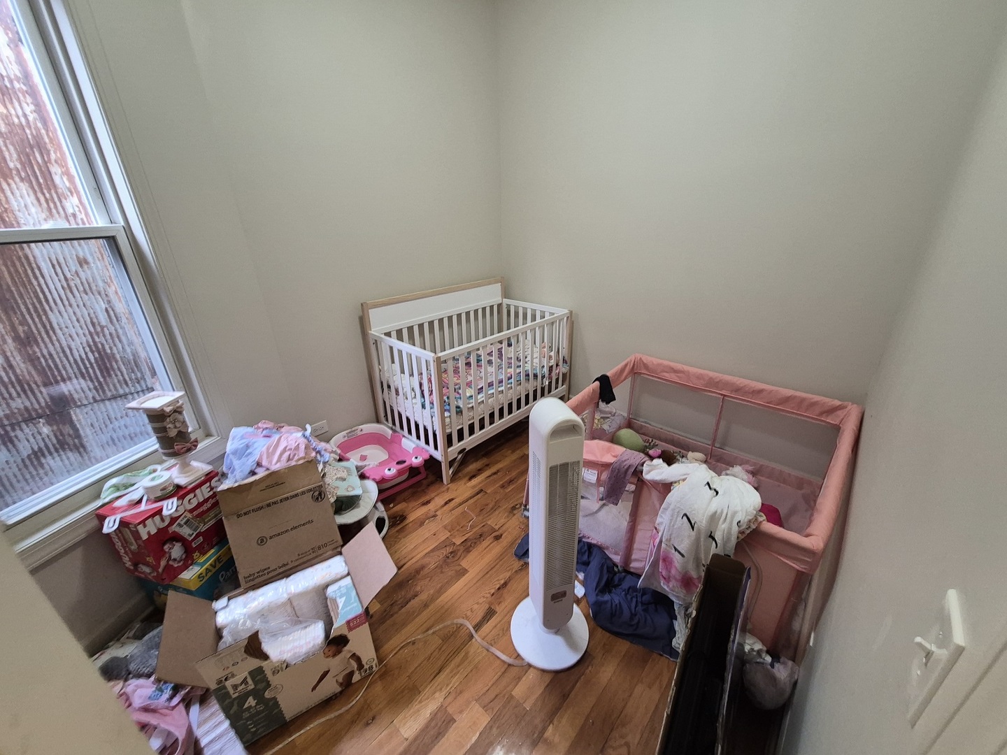 4126 West Adams Street Chicago, IL 60624 - Photo 11 of 19 a bedroom with a bed and wooden floor