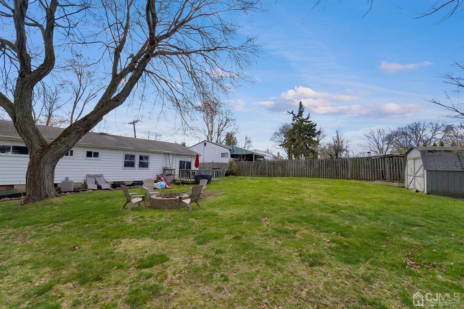 21 Villanova Road Old Bridge, NJ 08859 - Photo 15 of 15 a backyard of a house with table and chairs