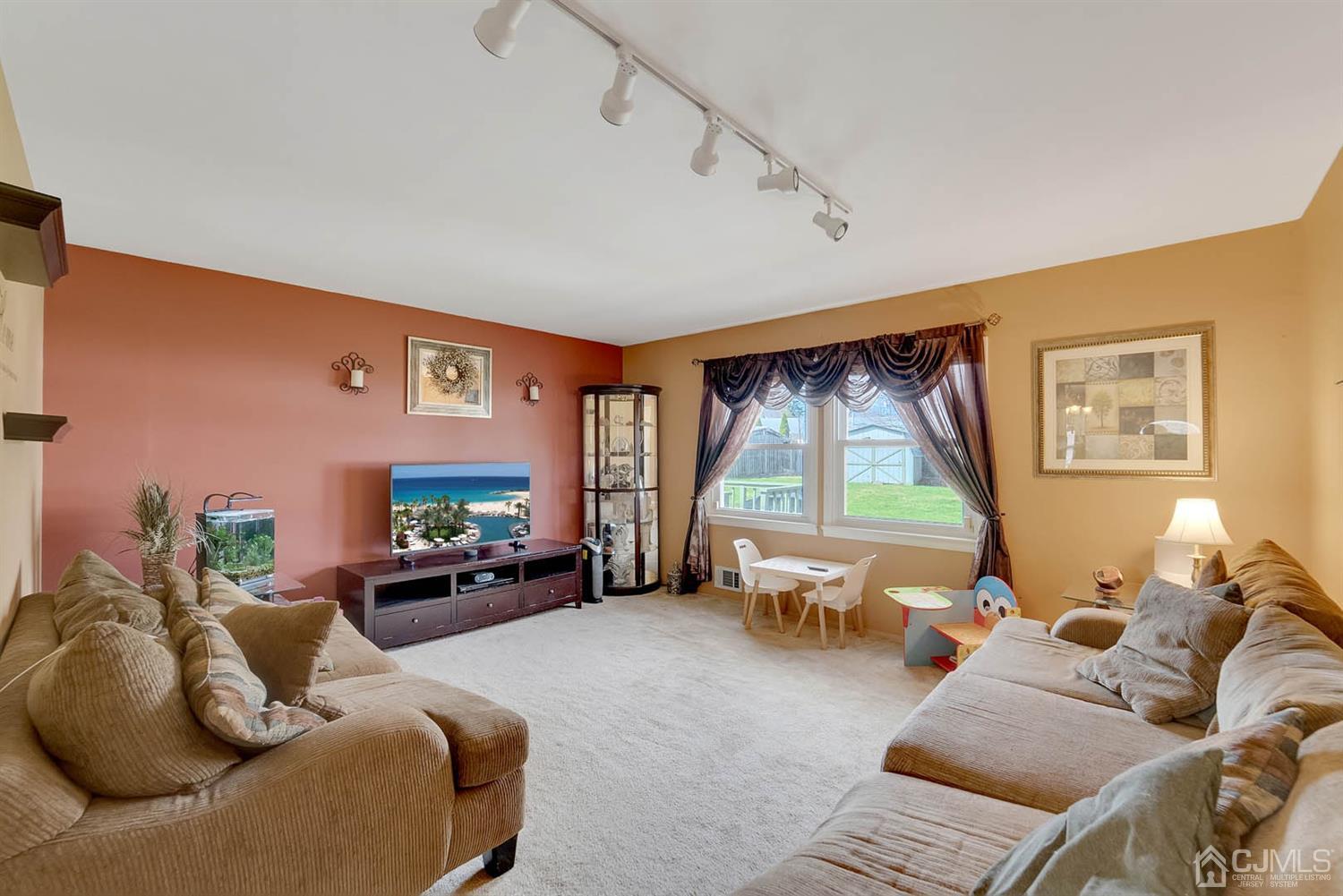 21 Villanova Road Old Bridge, NJ 08859 - Photo 6 of 15 a living room with furniture and a large window