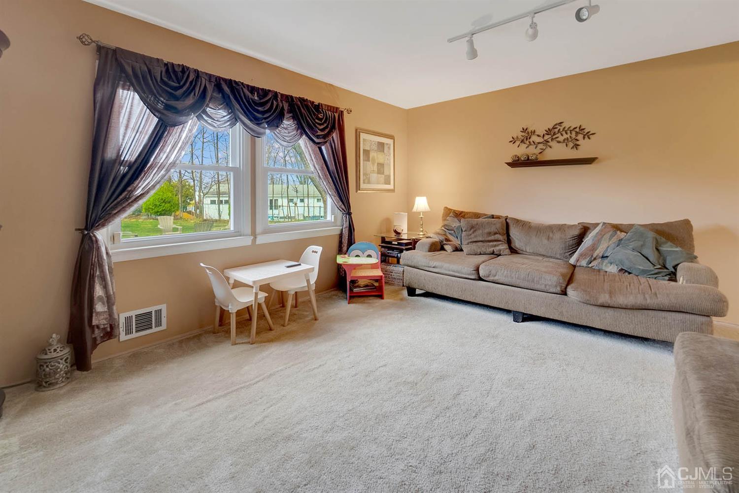 21 Villanova Road Old Bridge, NJ 08859 - Photo 7 of 15 a living room with furniture and a large window