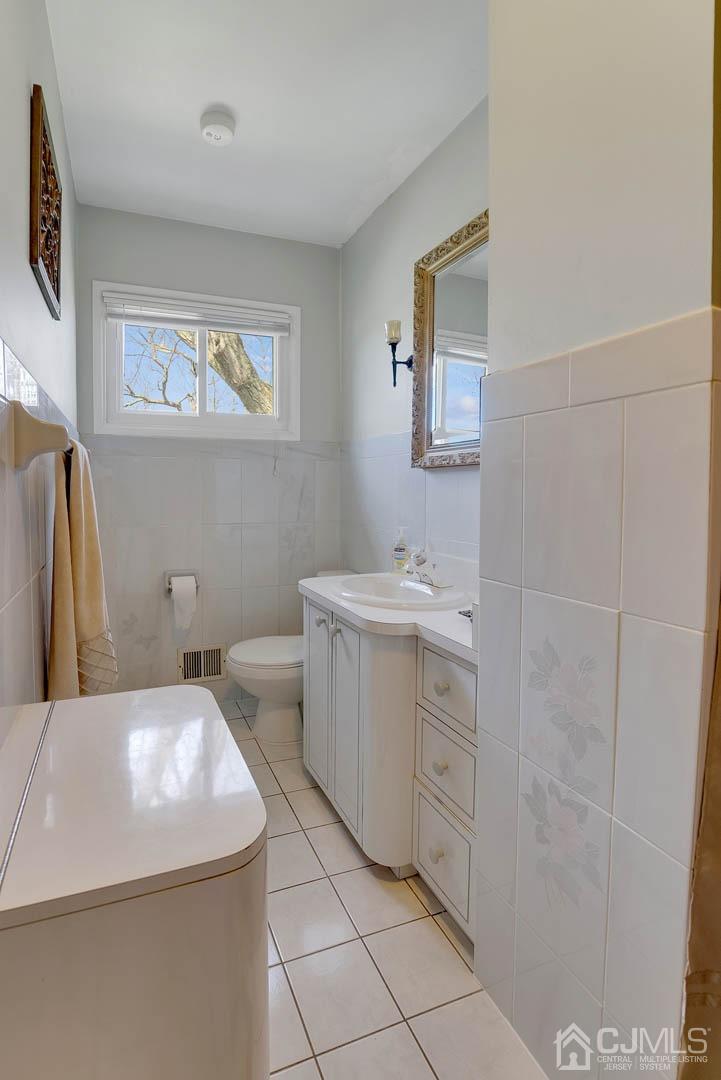 21 Villanova Road Old Bridge, NJ 08859 - Photo 8 of 15 a bathroom with a sink and a mirror