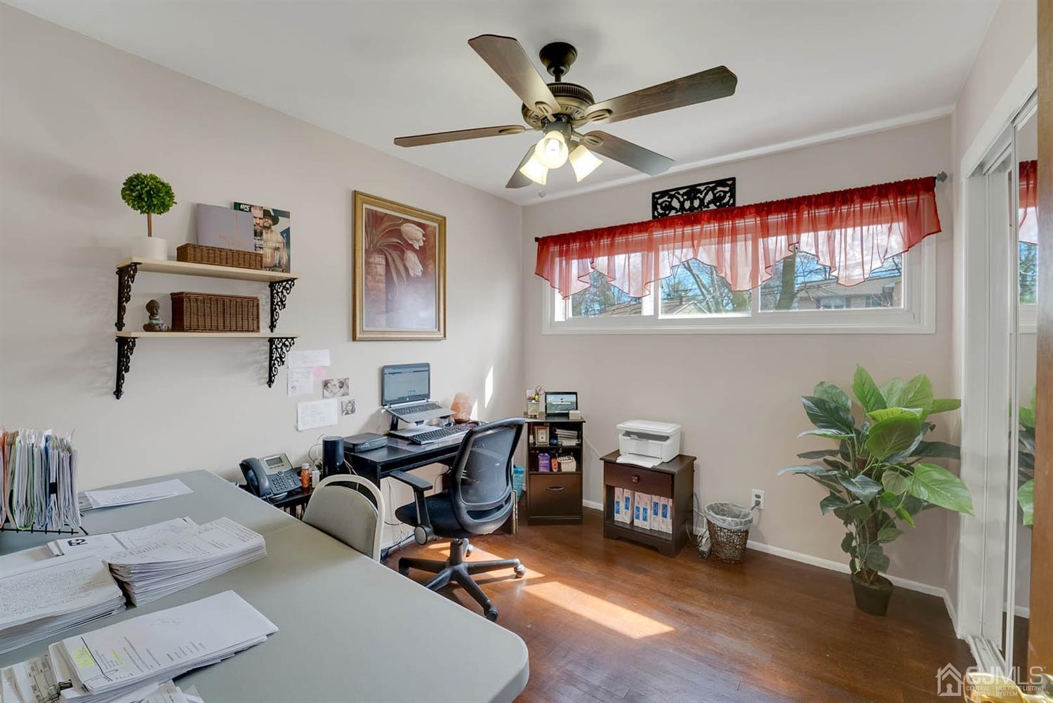 21 Villanova Road Old Bridge, NJ 08859 - Photo 10 of 15 a view of a workspace with furniture and a potted plant