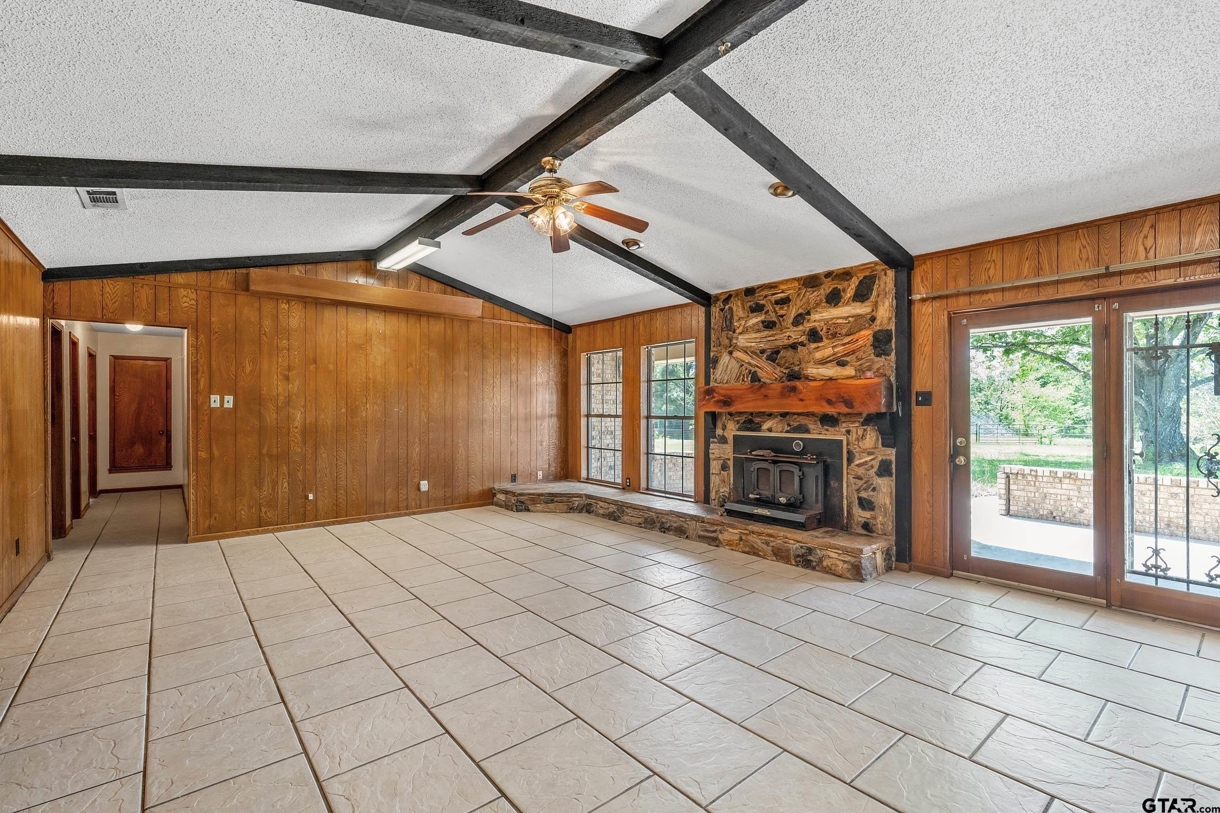 1382 VZ County Road Canton, TX 75103 - Photo 17 of 40 a view of an empty room with a fireplace and a window