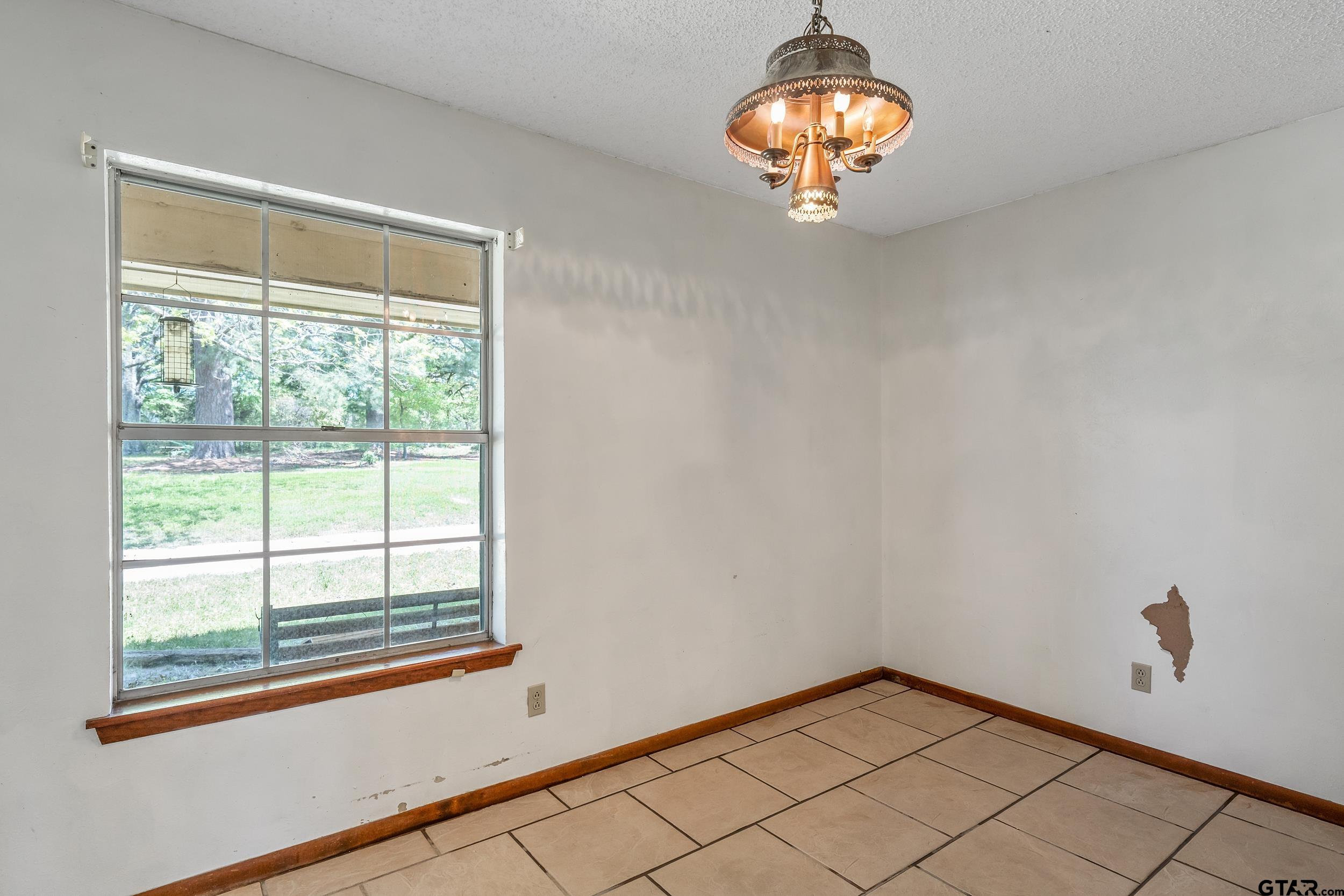 1382 VZ County Road Canton, TX 75103 - Photo 23 of 40 a view of a chandelier and window in the room