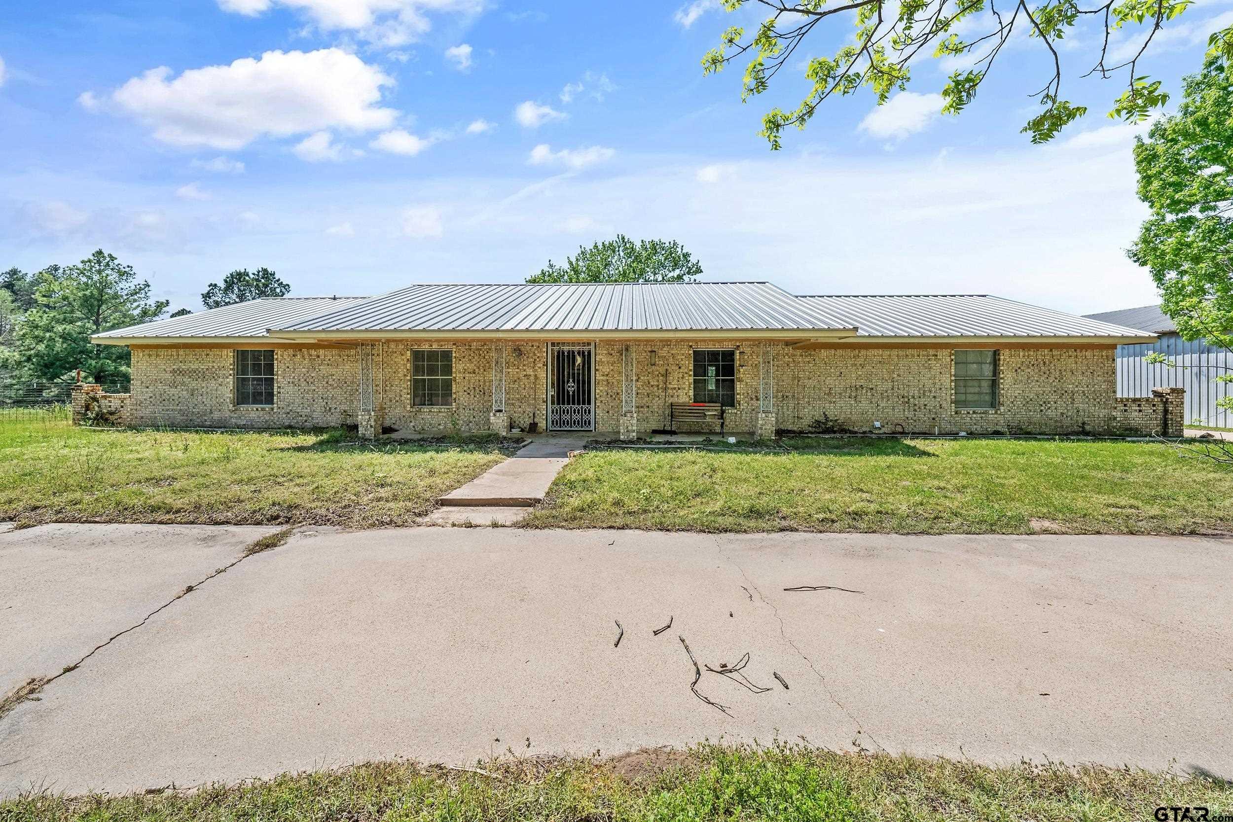 1382 VZ County Road Canton, TX 75103 - Photo 30 of 40 a front view of a house with a garden and yard