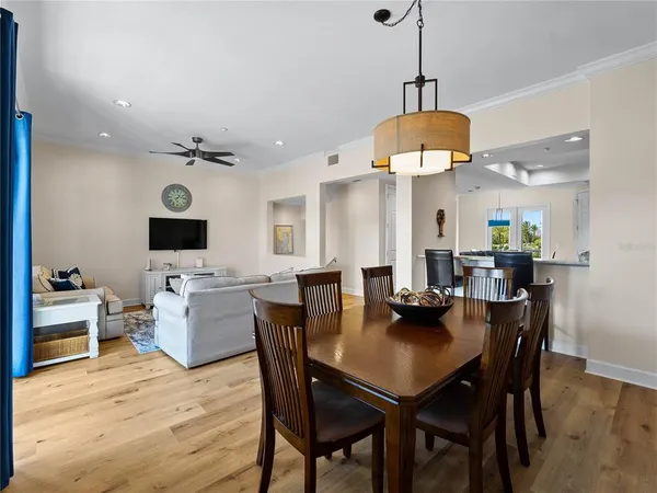 a kitchen with granite countertop stainless steel appliances sink stove microwave and cabinets