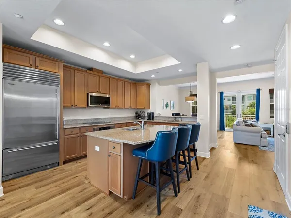 a kitchen with a sink and refrigerator
