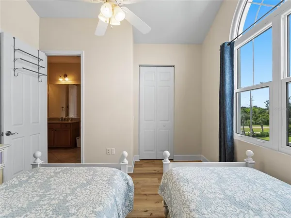 a view of a balcony with a floor to ceiling window wooden floor and a balcony