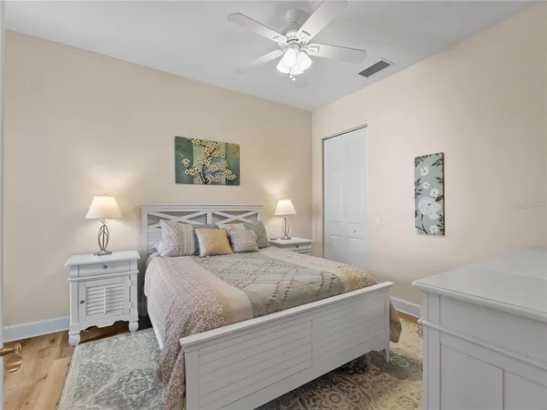 a living room with a balcony bed and a chandelier