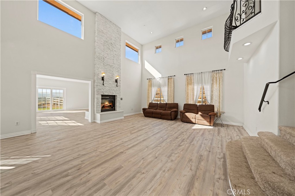 13560 Sego Road Agua Dulce, CA 91390 - Photo 13 of 75 a living room with furniture and a fireplace