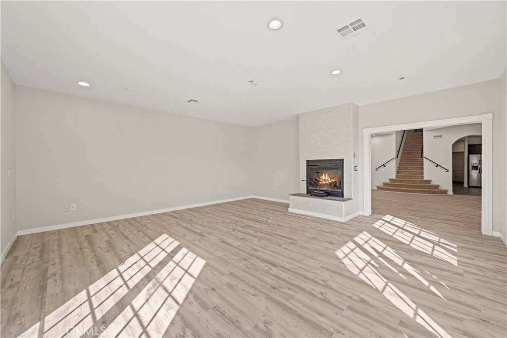 13560 Sego Road Agua Dulce, CA 91390 - Photo 18 of 75 a view of a livingroom with wooden floor and a flat screen tv