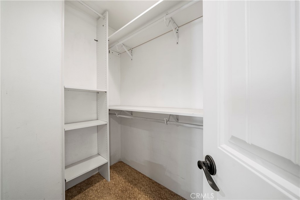 13560 Sego Road Agua Dulce, CA 91390 - Photo 33 of 75 a view of walk in closet with empty racks