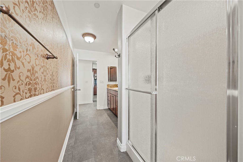 13560 Sego Road Agua Dulce, CA 91390 - Photo 48 of 75 a view of a hallway with wooden floor and staircase
