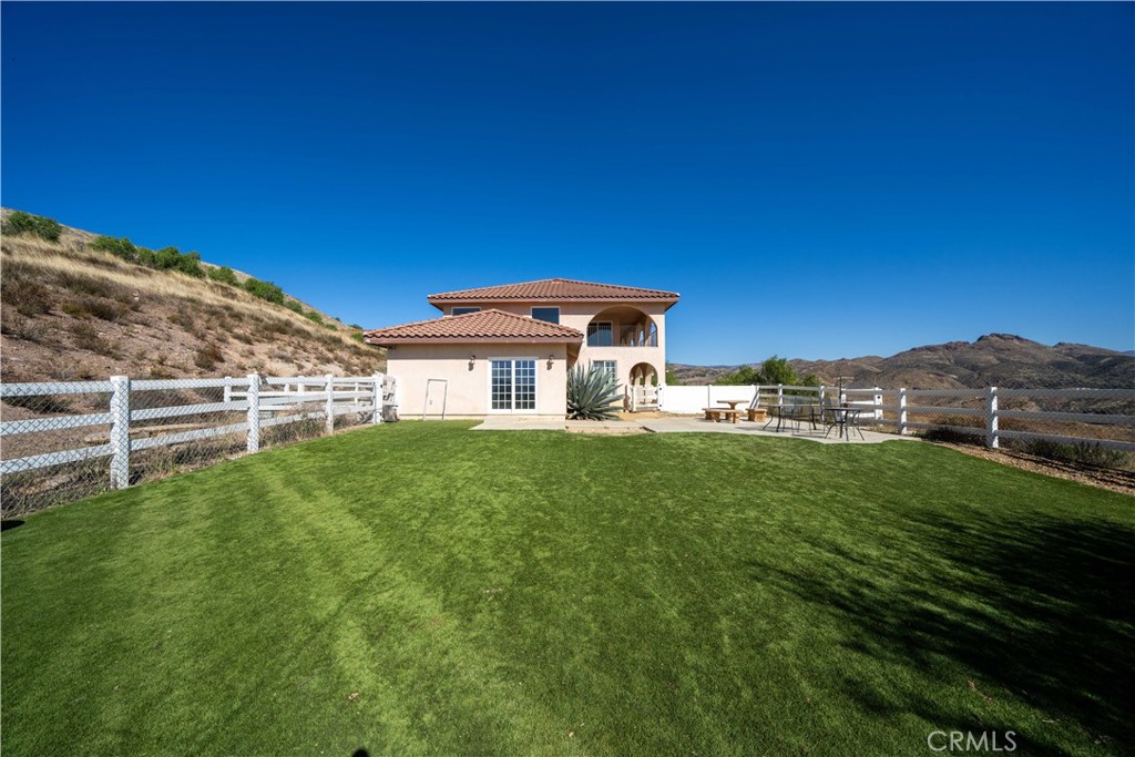 13560 Sego Road Agua Dulce, CA 91390 - Photo 55 of 75 a front view of a house with a garden