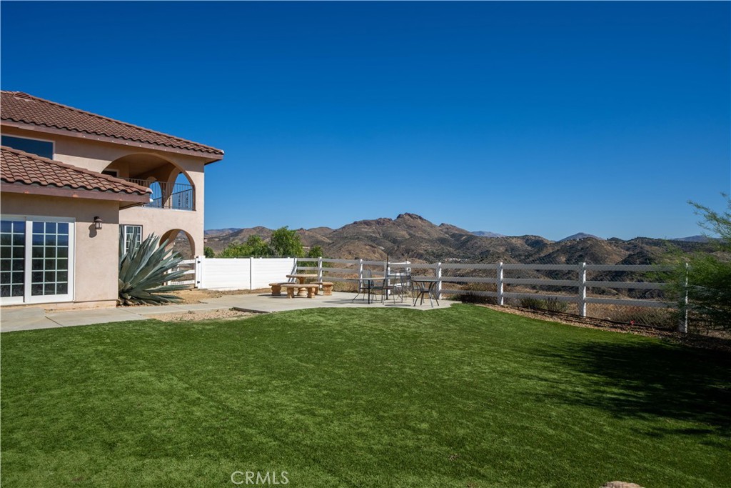 13560 Sego Road Agua Dulce, CA 91390 - Photo 56 of 75 a view of a house with a yard and sitting area