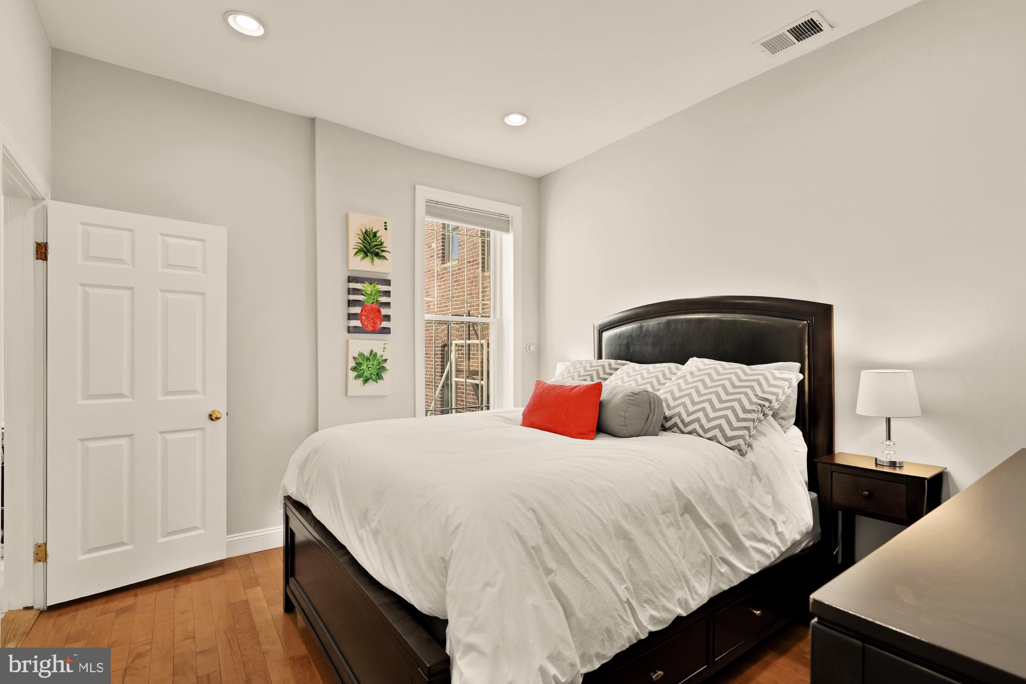 1933 18th Street Northwest, Unit 304 Washington, DC 20009 - Photo 11 of 24 a bedroom with a bed and a dresser